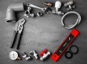 a bunch of different plumbing tools laid out on a table